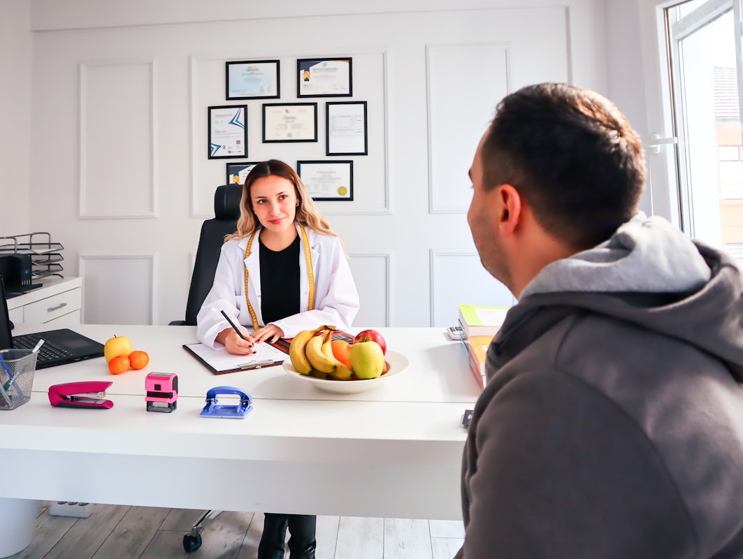 Nutritionist reviewing meal planning guidelines